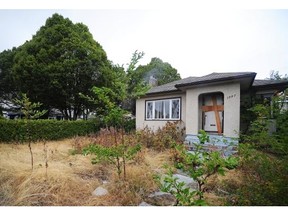 City of Vancouver crews clean up garbage which was dumped at a vacant house at 2057 E 49 Ave. in Vancouver, BC., August 6, 2015.