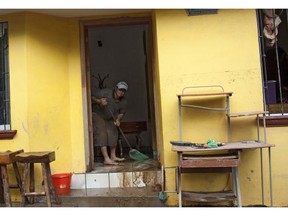 A man cleans flood water out of his house in Cihuatlan, Mexico.