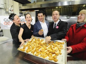 Commissary Connect owner Sarb Mund (third from left) and B.C. Agriculture minister Norm Letnick (second from right) joined Commissary Connect staff in sampling free-range chicken after the minister launched a comprehensive pan to increase food-sector revenues to $15 billion per year by 2020.