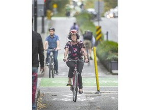Cyclists on Hornby street bike lane in Vancouver.