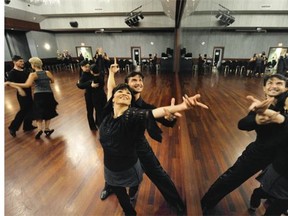 Dancers at the Broadway Ballroom show off some of their moves. Here Michelle Peng and Dimitri Mikulich practice their moves next to the giant mirror.