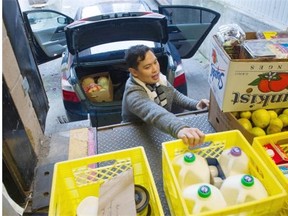 Danison Buan of Refood sorts donated food at Save-On-Foods in New Westminster.