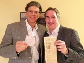 Darryl Segal (left) and Kevin Jampole hold the original newspaper articles.