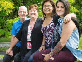 Dominique Ward, 16 (second from right), was adopted by her foster parents Allan and Cheryl in April, 2015, after living with them since the age of five. She is pictured here with her adoptive sister Richelle, 19.