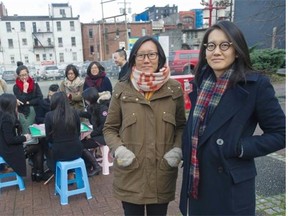 Doris Chow (left) and her sister June Chow co-founded the Youth Collaborative for Chinatown and have been holding monthly mah-jong social events that bring together senior citizens with hipsters over the poker-like game.