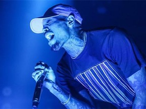 FILE - In this Friday, Dec. 18, 2015 file photo, Chris Brown performs at the Hollywood Palladium in Los Angeles. Las Vegas police are investigating an allegation of battery against R&B singer Chris Brown. Lt. Jeff Goodwin said authorities received a call Saturday, Jan. 2, 2016, about the alleged battery at the Palms Casino Resort. (Photo by Rich Fury/Invision/AP, File)