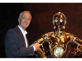 In this image taken from video, actor Anthony Daniels, who portrays C-3PO in the "Star Wars" films, appears with his robot counterpart at a preview for the "Star Wars and the Power of Costume" exhibition at Discovery Times Square Museum on Wednesday, Nov. 11, 2015. Daniels returns for the seventh time, the only actor who has starred in every Star Wars film, for "Star Wars: Episode VII - The Force Awakens," in U.S. theaters on Dec. 18. (AP Photo/Bruce Barton)