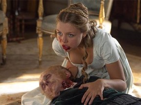 This image released by Screen Gems shows Jess Radomska in a scene from "Pride and Prejudice and Zombies." (Jay Maidment/Screen Gems, Sony via AP)