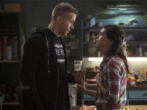 This image released by Twentieth Century Fox shows Ryan Reyonlds, left, and Morena Baccarin in a scene from "Deadpool." (