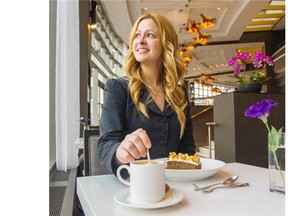 Etiquette consultant Carey McBeth quietly stirs her coffee at Arc Restaurant in the Fairmont Waterfront hotel.