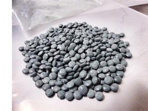 Fentanyl pills are shown in an undated police handout photo. THE CANADIAN PRESS/HO