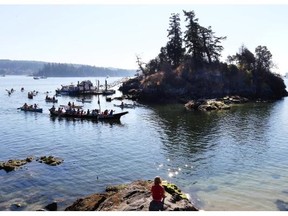 File photo: Island residents together with First Nations elders took to the water to demand a halt to the construction of a luxury home on Grace Islet. Grace Islet in Ganges Harbour on Salt Spring Island on August  26, 2014.   Organized by Salt Spring Islanders for Justice and Reconciliation and Salt Spring Residents for Responsible Land Use, the gathering was in solidarity with First Nations to stop the desecreation of the tiny islet which their people have used a cemetary for a thousand years or more.