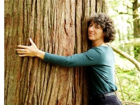 File: Valerie Langer hugging in a tree.