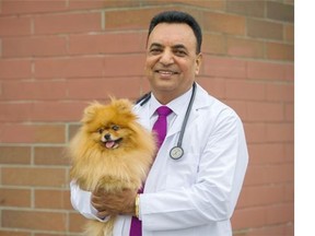 Veterinarian Dr. Hakam Bhullar at the Atlas Vet Clinic, Vancouver October 08 2015.  Dr Bhullar and other Indo-Canadian vets have won a human rights complaint against the Province's veterinary college.