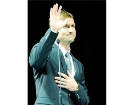 Former Canucks captain Markus Naslund waves to the crowd during the retirement ceremony of his No. 19 at Rogers Arena on Dec. 11, 2010.