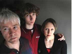 Former Russian KGB agent Mikhail Lennikov (left) shown with his son Dmitre and wife Irina in 2009.