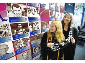 Former Vancouver Sun sports reporter Wendy Long, right, celebrates with longtime friend and former Olympic runner Lynn Kanuka following Long’s announced induction to the B.C. Sports Hall of Fame.