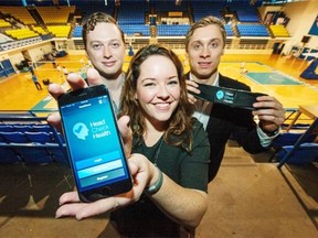 From left: Alexey Manov, Kerry Costello and Harrison Brown display a concussion app at UBC. These three who are behind HeadCheck Health, who have developed and are about to market an application to detect concussions. The app, which can be accessed by iPhone, iPad or iPod, can help trainers assess symptoms via a test administered on the sidelines.