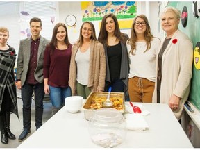 From left, Mary-Ann Brown, principal of Douglas Road Elementary; and Beedie Development Group employees Mason Bennett, Chelsea Virji, Stefani Burr, Bahare Poleshuk, Trisha Bouchard and Laurie Svensson pose for a photo after helping serve lunch at the school as part of the The Vancouver Sun Children’s Fund Adoptive-a-School initiative.