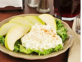 Fruit with cottage cheese is a great snack to stave off hunger.