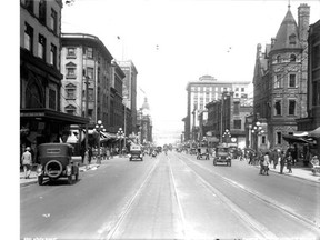 Granville Street in 1921, showing cars driving on the left. Cars did not drive on the right in Vancouver until January 1, 1922. W. J. Moore, City of Vancouver Archives, LGN 1026.