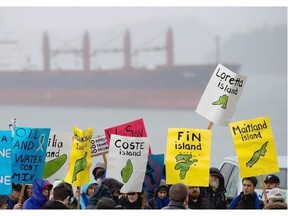 A group of protesters outside the Northern Gateway hearings in Prince Rupert in 2012. Prime Minister Justin Trudeau promised during the election to ban crude oil tankers on the north coast.