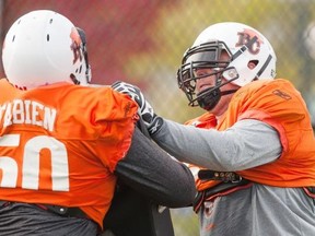 Hunter Steward (67) of the BC Lions takes part in blocking drills during the team practice at their practice facility in Surrey, BC, October, 20, 2015.