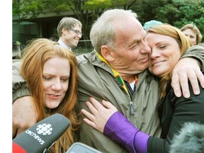 Ivan Henry in 2010 with daughters Tanya and Kari after being acquitted of his rape charges.