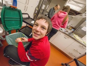 Jaden Keith helps out during the student cooking program at West Coast Alternate School in Vancouver.