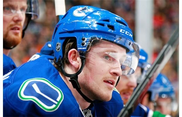 Jared McCann #91 of the Vancouver Canucks looks on from the bench during their NHL game against the Edmonton Oilers at Rogers Arena December 26, 2015 in Vancouver, British Columbia, Canada.