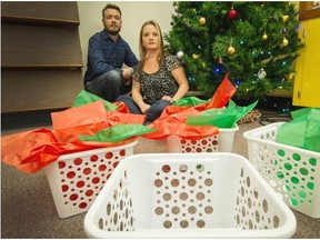 Jarno Karjanlahti, an assistant pastor at 19Twenty Church, left, and youth and family worker Carley Romas distribute hampers to families living on the south slope. They’re asking for help filling the hampers with food and clothing this year.