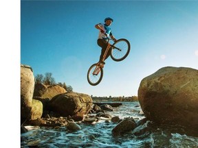 Jeff Anderson of New West navigates his bike from one rock to another at English Bay in Vancouver, BC. November 9, 2015. Mountain bike trials, also known as observed trials, is a discipline of mountain biking in which the rider attempts to pass through an obstacle course without setting foot to ground.