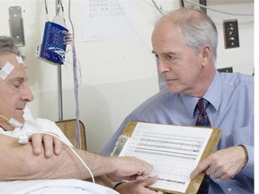 Dr. John Fleetham, co-director of the UBC Hospital Sleep Disorders Program, with a patient.