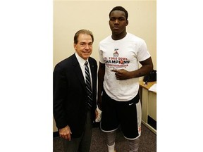 Jonathan Kongbo, right, with University of Alabama head coach Nick Saban, one of many U.S. coaches trying to recruit him.