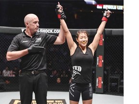 Just 19, Vancouver-born MMA fighter Angela Lee (right) showed a repertoire well beyond her years last month when she stopped Australian Natalie Gonzales Hills in Singapore using a rare twister submission. THE CANADIAN PRESS/HO