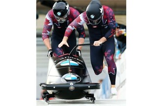 Justin Kripps, front, and Alex Kopacz compete in a Latvian-made BTC sled on Dec. 5 in Winterberg, Germany. The new sled is faster than the Eurotech sleds they had previously used in competition.
