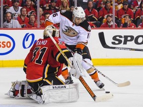 Emerson Etem, in action last season for the Anaheim Ducks, challenges Calgary Flames goalie Karri Ramo during an NHL game in Calgary. Etem was traded to the Vancouver Canucks on Friday.