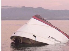 The bow of the Leviathan II, a whale-watching boat owned by Jamie’s Whaling Station that capsized in October, is seen near Vargas Island looking towards Cat Face Island as it waits to be towed into town for inspection in Tofino, B.C., Tuesday, October 27, 2015. Six people died in the tragedy.