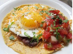 Top black beans with fried eggs and serve them with salsa, sour cream and tortilla chips for an easy take on huevos rancheros.