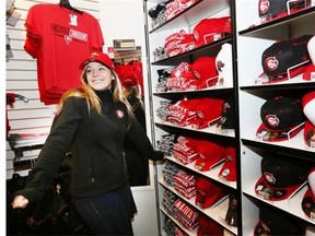 Lindsay Scharf models some of the popular Vancouver Canadians jerseys, hats and gift ideas.