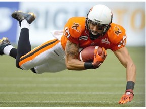 Nick Moore, shown here in 2012, will be back in orange with the B.C. Lions this coming season after signing as a free agent with the CFL club.
