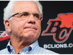 B.C. Lions head general manager Wally Buono pauses for a moment during a news conference at the teams practice facility in Surrey, B.C., on Monday, Nov. 17, 2014.