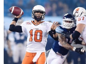B.C. Lions’ quarterback Jonathon Jennings looks for the pass during first half CFL football action against the Toronto Argonauts, in Toronto, on Friday, Oct. 30, 2015.