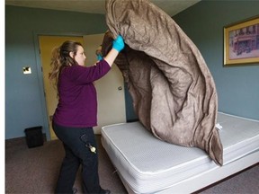 Lisa Goodsell cleans a barracks room at Canadian Forces Base Kingston, in Ontario. Several of the bases’s barracks will be used by Syrian refugess.