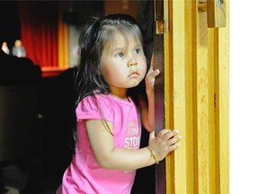 A little girl watches an annual graduation ceremony for aboriginal students in Vancouver. Across the province last year, 62 per cent of aboriginal students graduated. File photo.