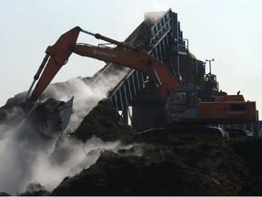 Heavy machinery is used to move compost at Harvest Power’s Richmond facility.