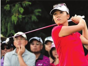 Lydia Ko of New Zealand hits a tee shot during final-round action at the Canadian Pacific Women's Open at the Vancouver Golf Club last August.