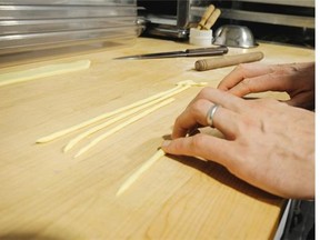 Making fresh pasta: Divide into small balls and roll out, using a pasta machine or wooden dowel.