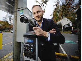 Malcolm Shield, Vancouver’s climate policy manager, stands by an electric car charging station near city hall. The Renewable City Strategy, which aims to wean the entire city off fossil fuels, is scheduled to go before council next Tuesday.