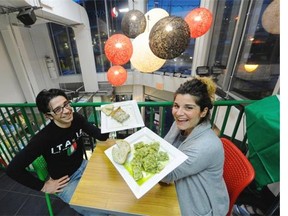 Vittorio Checcacci and his wife Lucia, right, show the pasta that Vittorio made from scratch at their Robson Street restaurant.